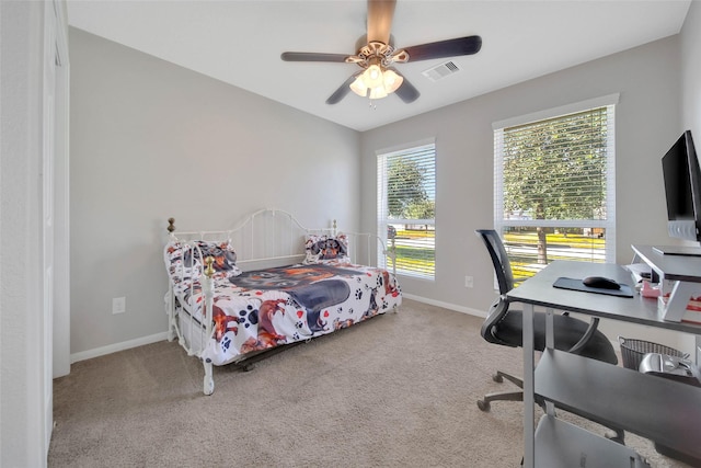 9924 Lace Flower Way, Conroe, TX 77385 - carpeted bedroom with baseboards, a desk, and ceiling fan