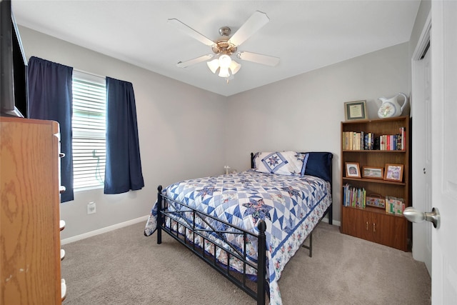 9924 Lace Flower Way, Conroe, TX 77385 - carpeted bedroom with multiple windows, baseboards, and ceiling fan