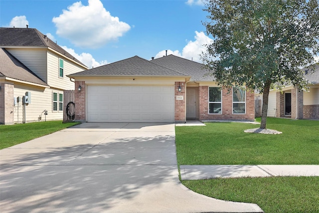 9924 Lace Flower Way, Conroe, TX 77385 - view of front of home with an attached garage, driveway, brick siding, a front yard, and a shingled roof