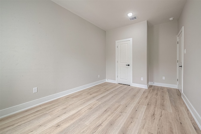 spare room with light wood-type flooring