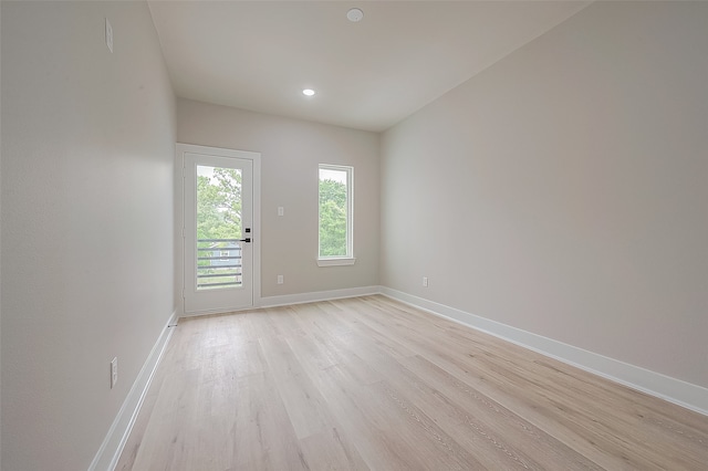 empty room with light hardwood / wood-style floors