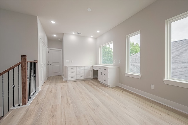 unfurnished office featuring light wood-type flooring