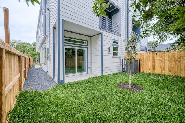 view of side of property with a yard