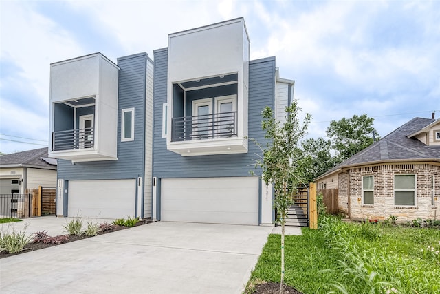 contemporary house with a balcony and a garage