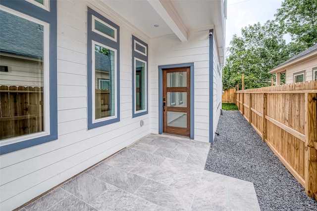 entrance to property featuring a patio