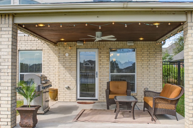 view of patio featuring a grill and ceiling fan