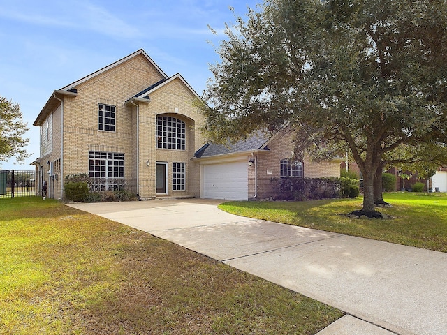 view of front property with a front lawn and a garage