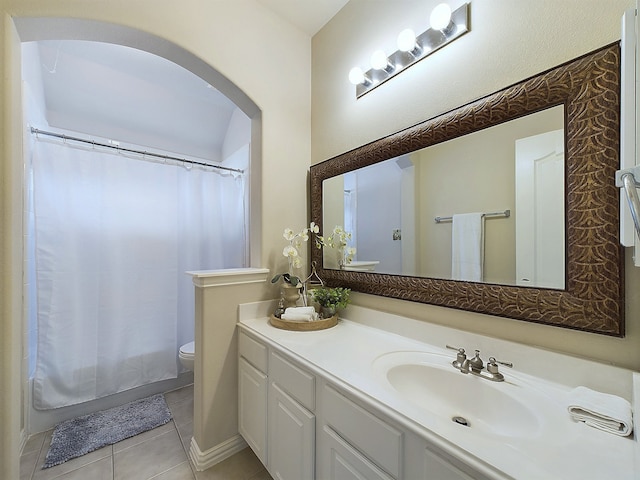 full bathroom featuring toilet, vanity, tile patterned floors, and shower / bathtub combination with curtain