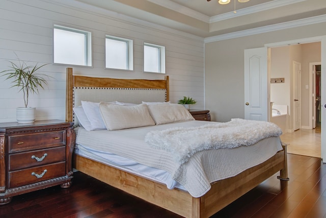 bedroom featuring wood-type flooring and crown molding