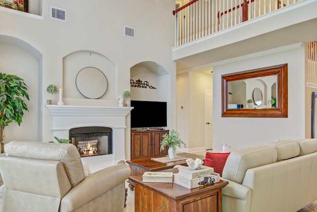 living room with a towering ceiling