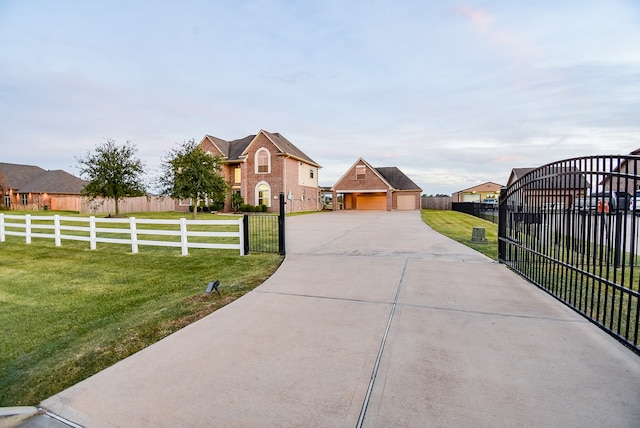 view of front of home with a front lawn and a garage