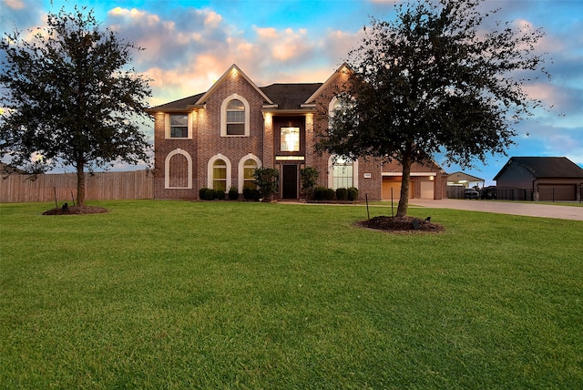 view of front facade featuring a yard and a garage