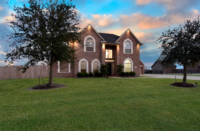 view of front of home featuring a yard and a garage