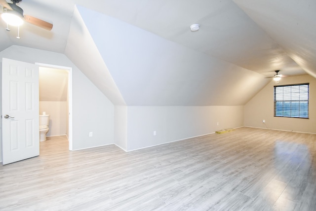 bonus room with vaulted ceiling, light hardwood / wood-style flooring, and ceiling fan