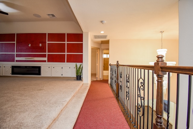 hallway featuring carpet flooring