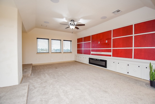 unfurnished living room featuring light carpet, lofted ceiling, and ceiling fan