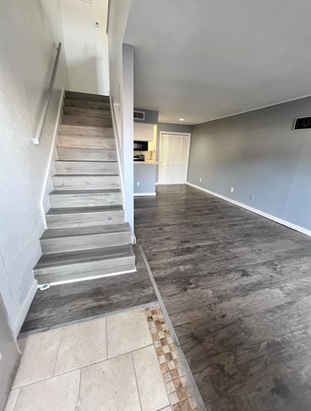 stairway featuring hardwood / wood-style floors