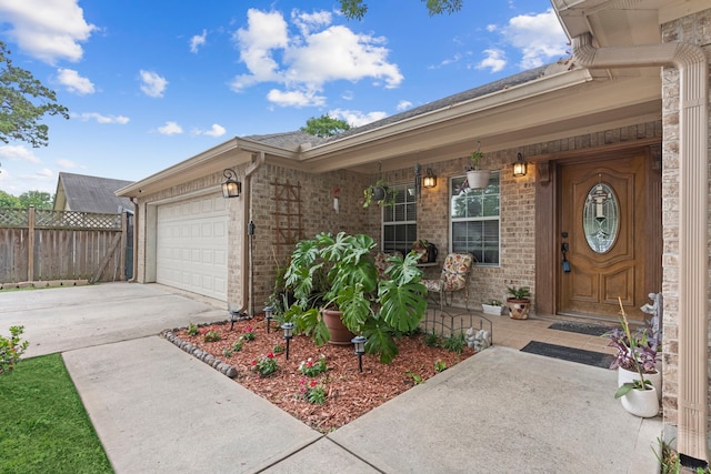 doorway to property with a garage