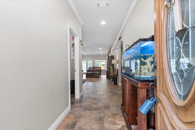 631 Apache St, Houston, TX 77022 - hall featuring ornamental molding, baseboards, stone tile flooring, and recessed lighting