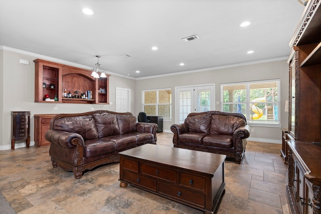 living room with french doors and ornamental molding