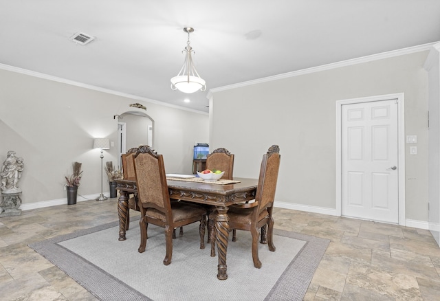 631 Apache St, Houston, TX 77022 - dining room with stone tile flooring, ornamental molding, and baseboards