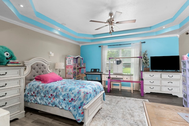 631 Apache St, Houston, TX 77022 - bedroom with a tray ceiling, wood finished floors, crown molding, ceiling fan, and recessed lighting