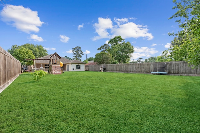 631 Apache St, Houston, TX 77022 - view of yard featuring a trampoline and stairway