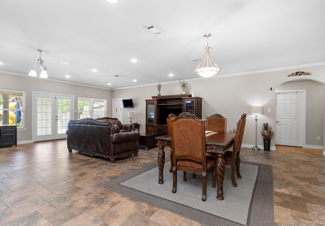 631 Apache St, Houston, TX 77022 - dining space with crown molding, baseboards, stone tile floors, and recessed lighting