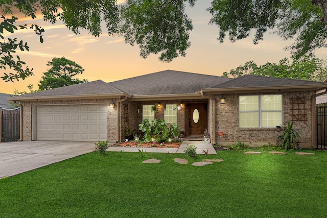 631 Apache St, Houston, TX 77022 - single story home featuring an attached garage, brick siding, and driveway