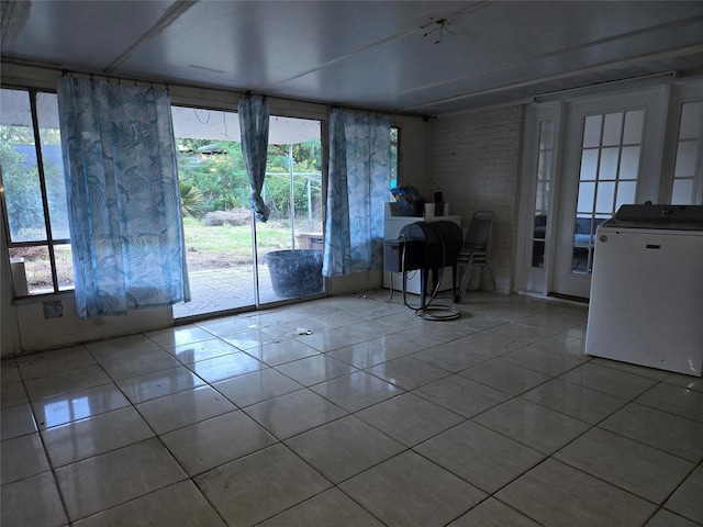 interior space with a wealth of natural light and light tile patterned floors