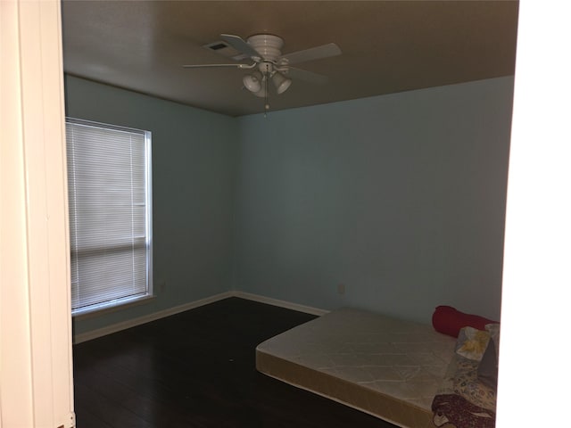 bedroom featuring hardwood / wood-style floors and ceiling fan