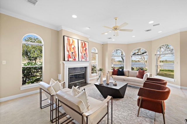 living room featuring crown molding, plenty of natural light, and light colored carpet