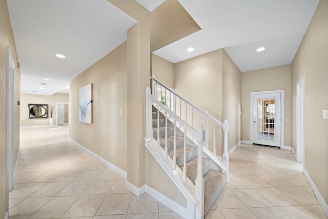 hall featuring light tile patterned flooring