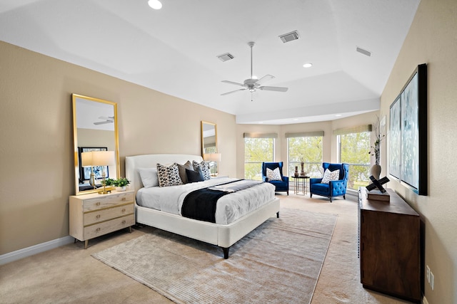 bedroom with ceiling fan, light carpet, and vaulted ceiling