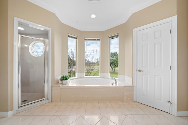 full bathroom with tile patterned flooring, ornamental molding, a bath, and a stall shower