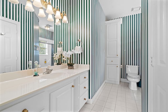 bathroom featuring vanity, toilet, and tile patterned floors