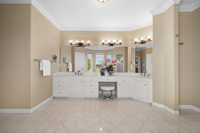 bathroom featuring crown molding, a sink, baseboards, and double vanity
