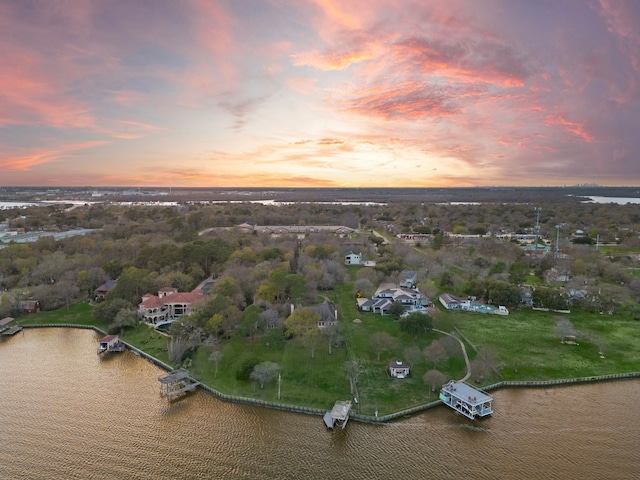 aerial view at dusk with a water view