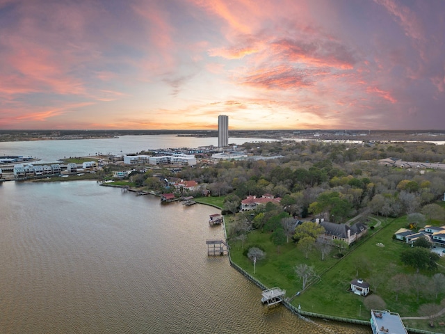 aerial view at dusk with a water view