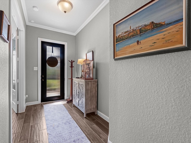 foyer featuring hardwood / wood-style floors and crown molding