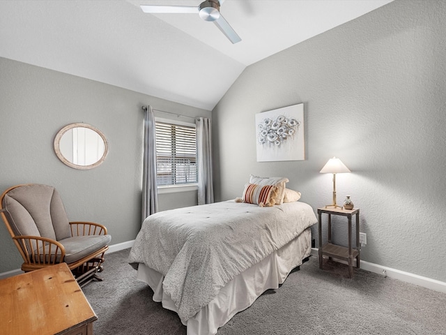 bedroom with ceiling fan, lofted ceiling, and dark carpet