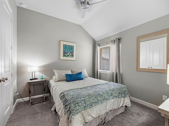 carpeted bedroom featuring lofted ceiling and ceiling fan