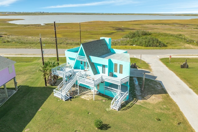 drone / aerial view with a water view and a rural view