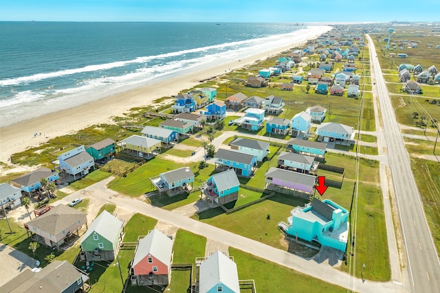 aerial view with a water view and a view of the beach