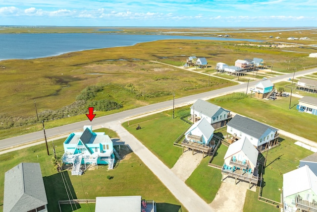 birds eye view of property with a rural view and a water view