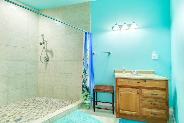 bathroom featuring vanity, a shower with shower curtain, and tile patterned flooring