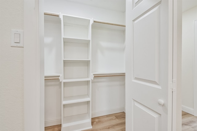 walk in closet featuring light wood-type flooring