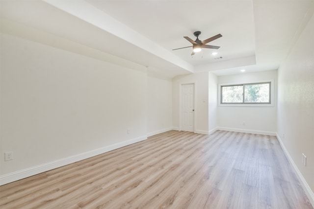 empty room featuring light wood-type flooring and ceiling fan