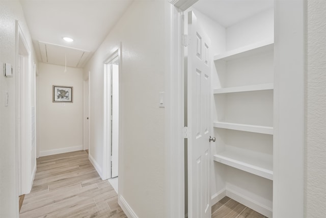 corridor featuring light hardwood / wood-style floors