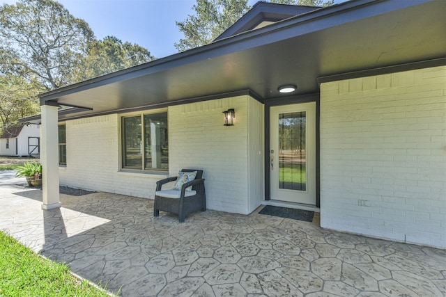 doorway to property with a patio